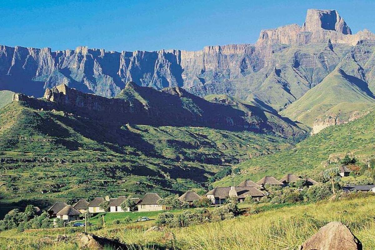 a view of a mountain with houses and mountains