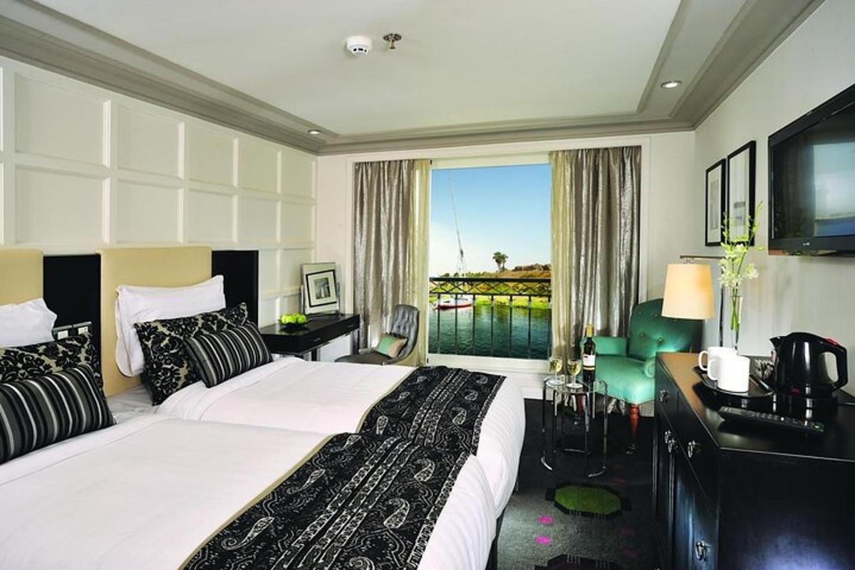 a hotel room with a large bed and a window