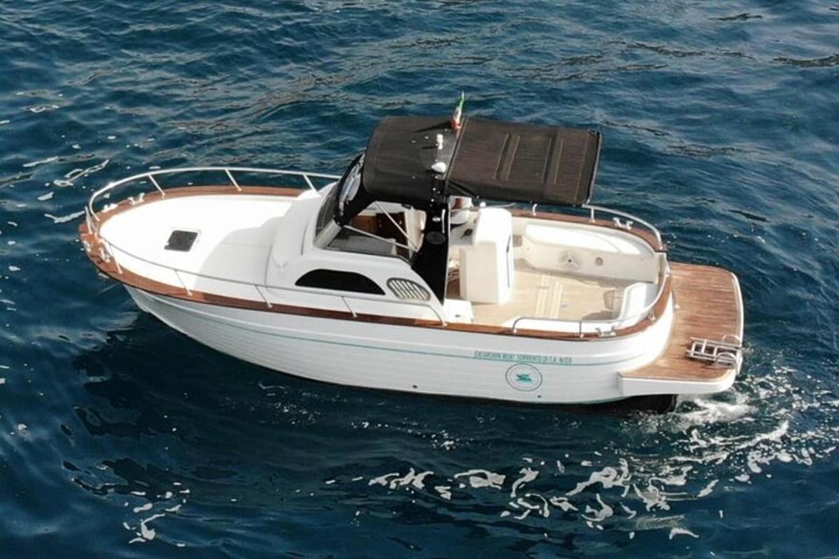 a white boat floating in the water
