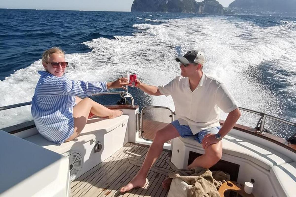 a man and a woman sitting on a boat