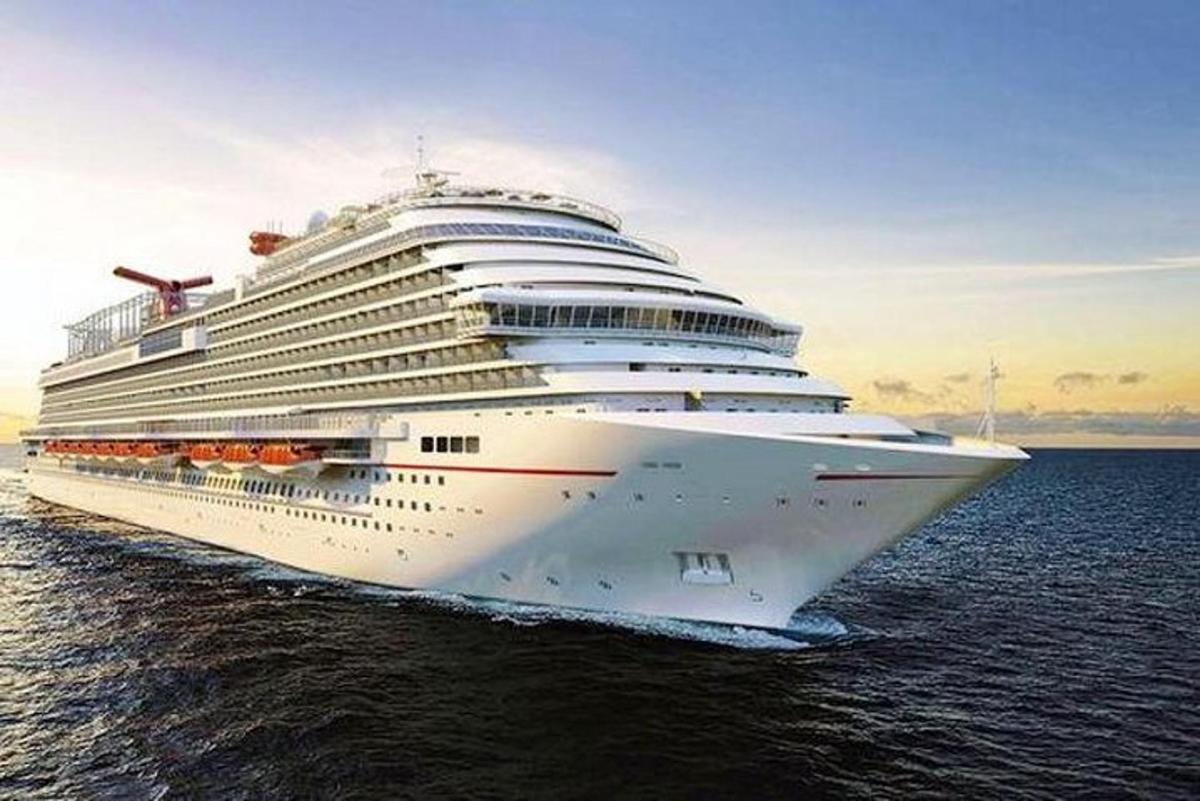 a cruise ship in the water at sunset