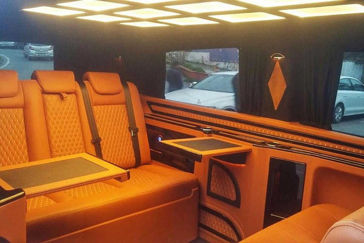 an inside view of a bus with orange seats