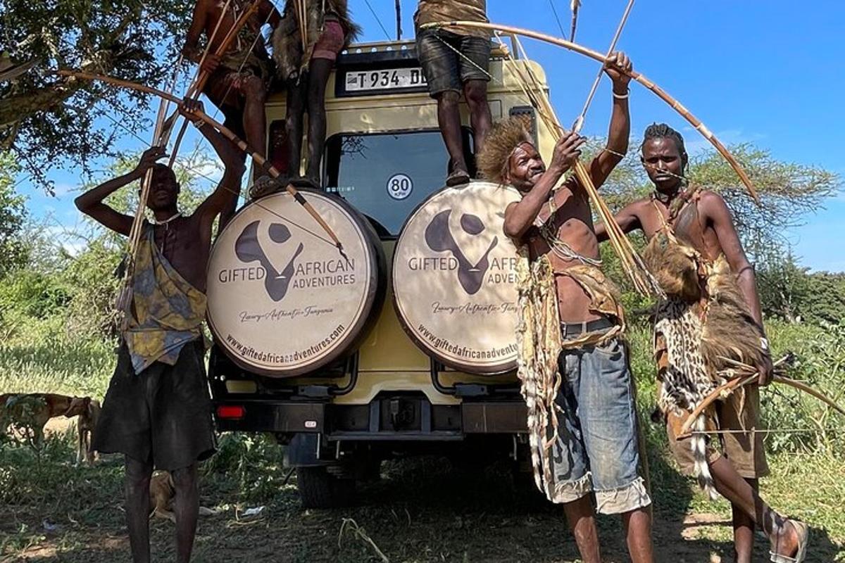 a group of people standing in front of a truck