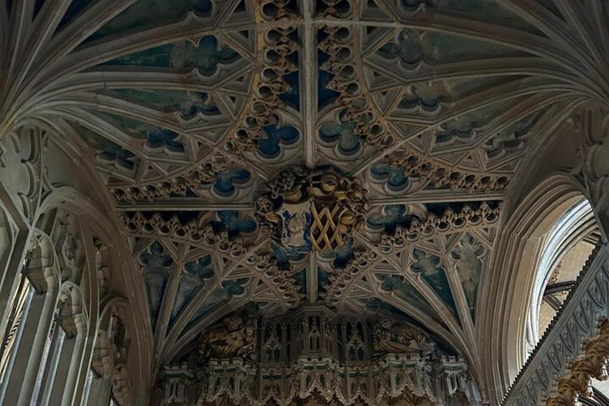 an ornate ceiling of a building with a clock on it