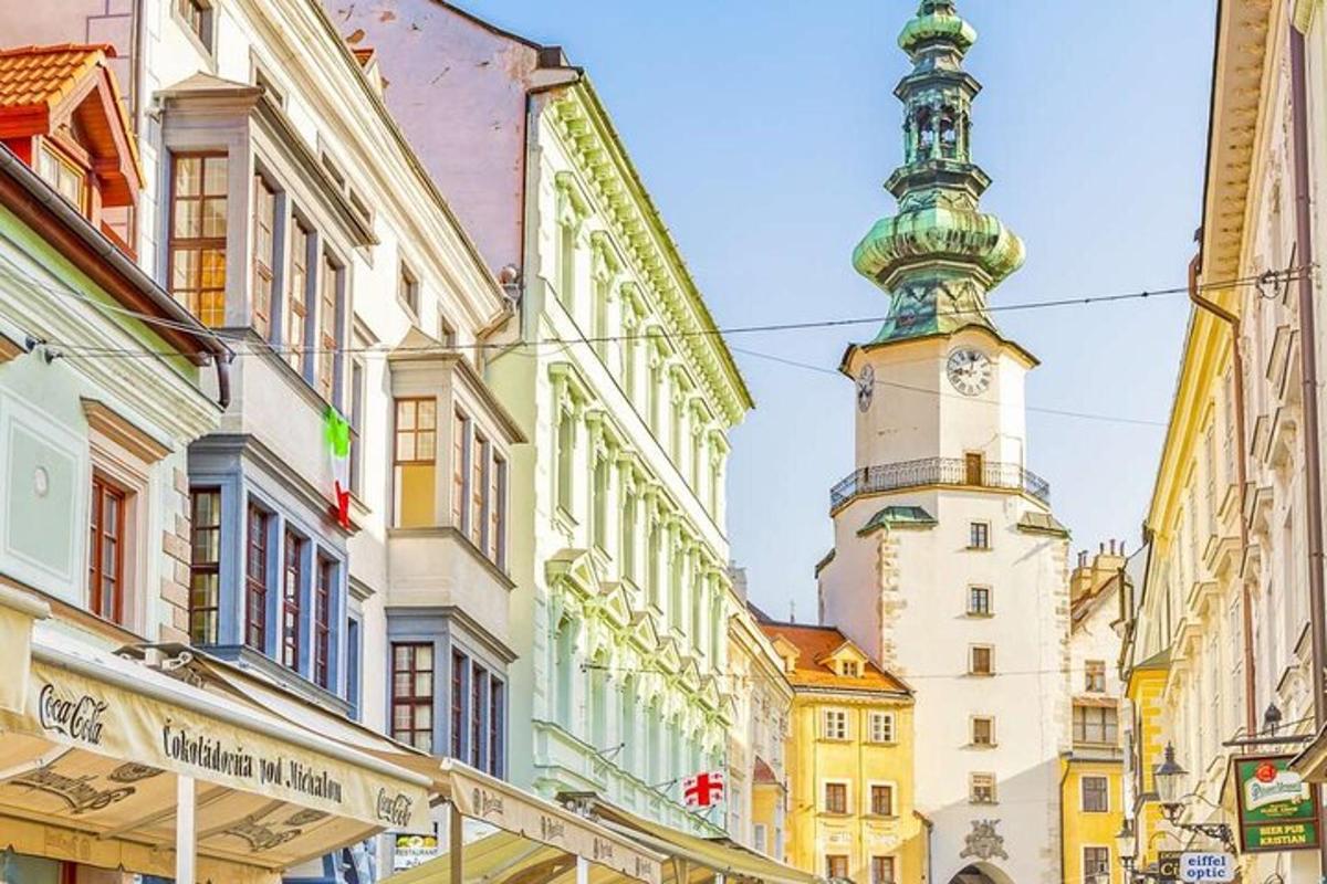 a tall building with a clock tower in a city