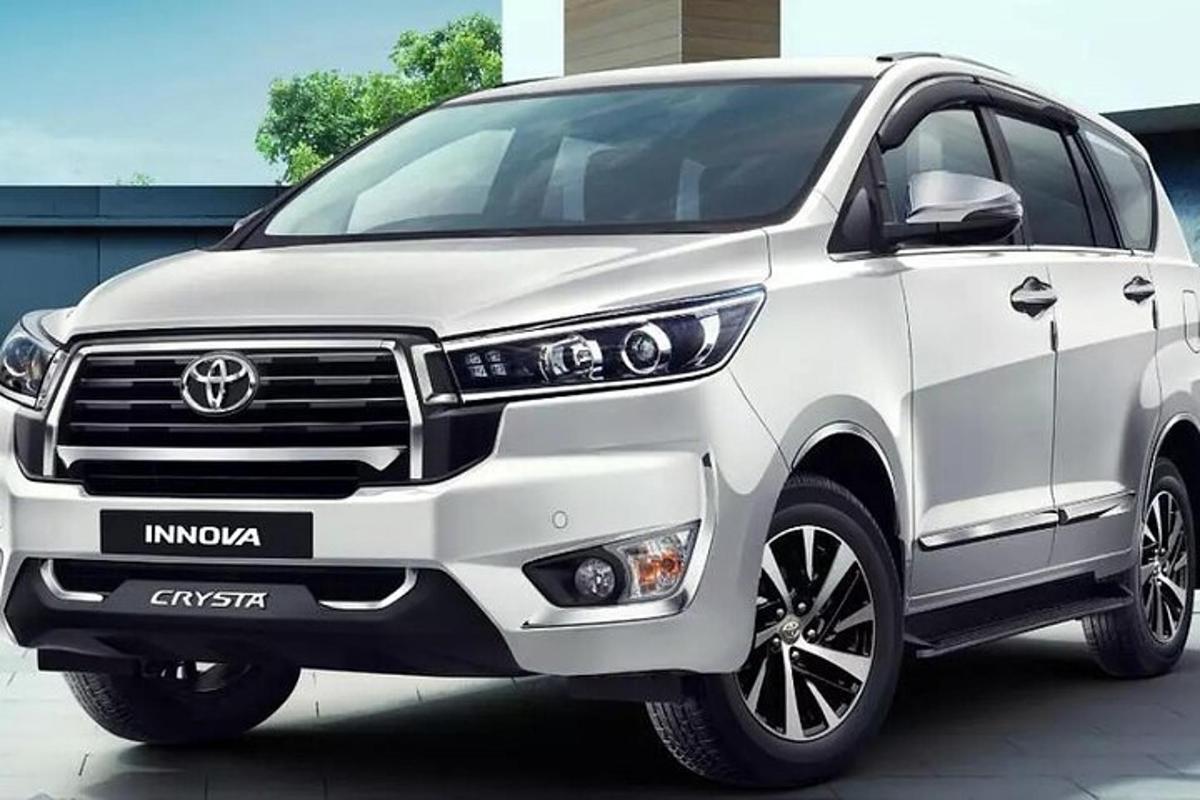 a white toyota fortuner parked in a parking lot