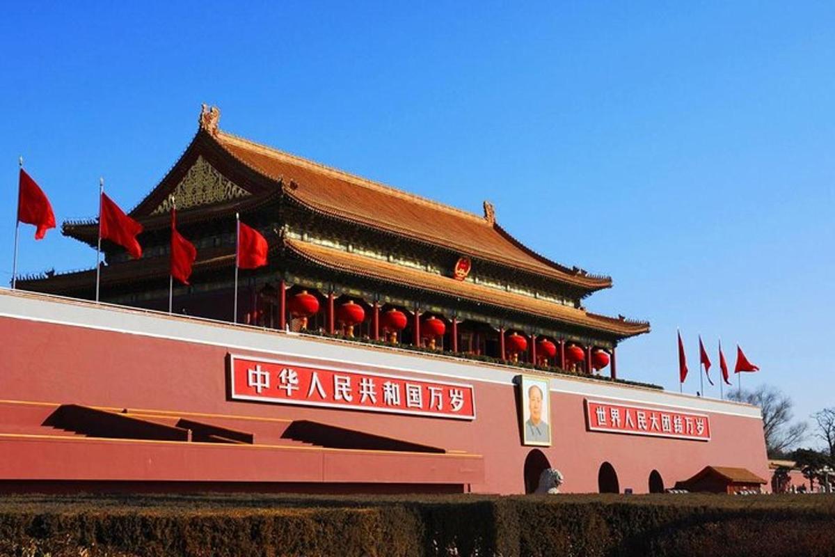 a building with red flags in front of it
