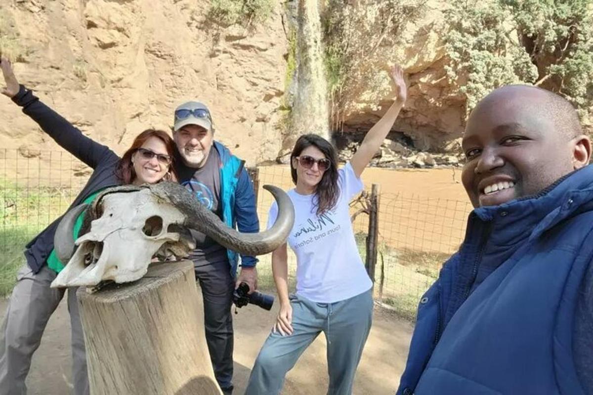 a group of people standing next to a skull
