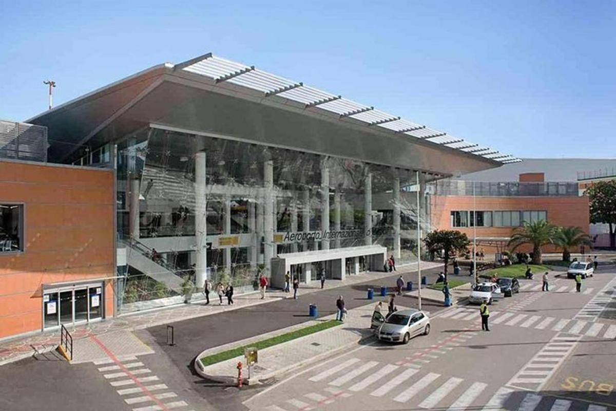 a large building with cars parked in a parking lot