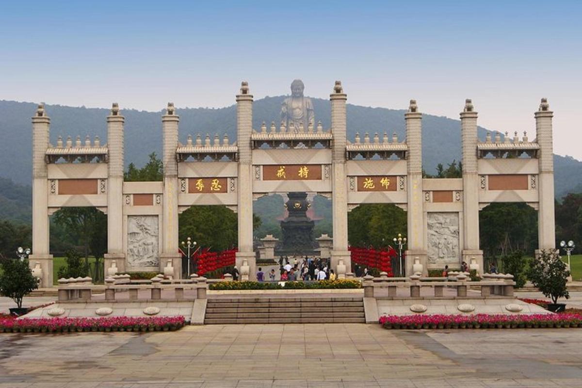 a large building with a statue in front of it