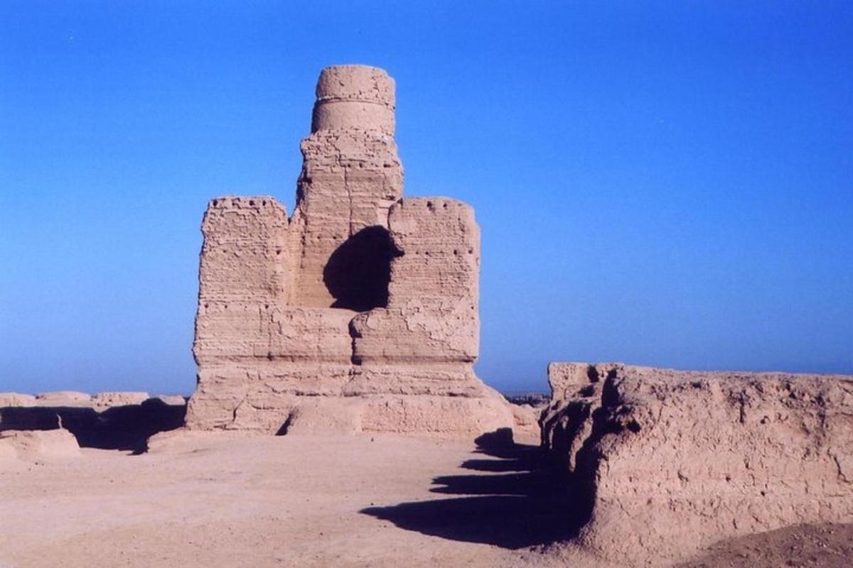 a stone tower in the middle of a desert