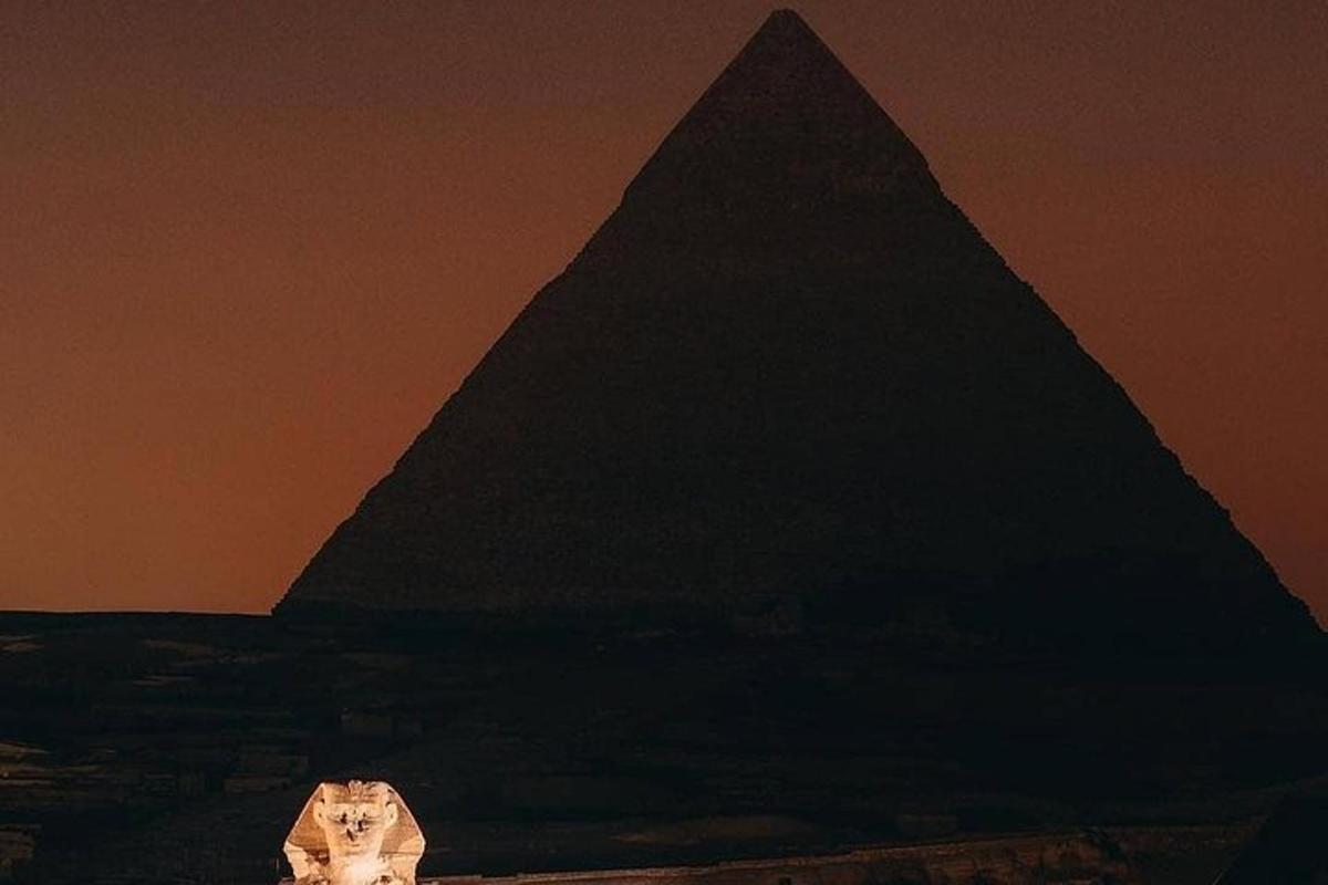 a pyramid and a building in front