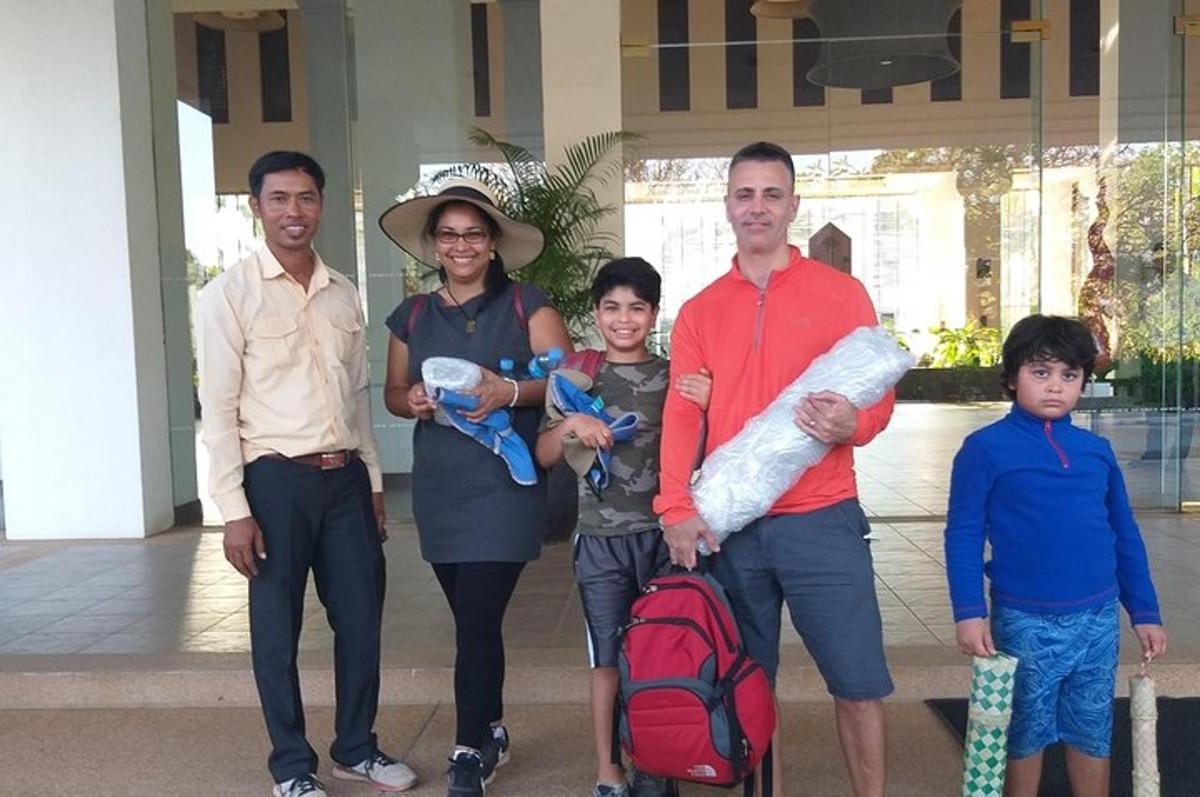 a family posing for a picture in front of a building