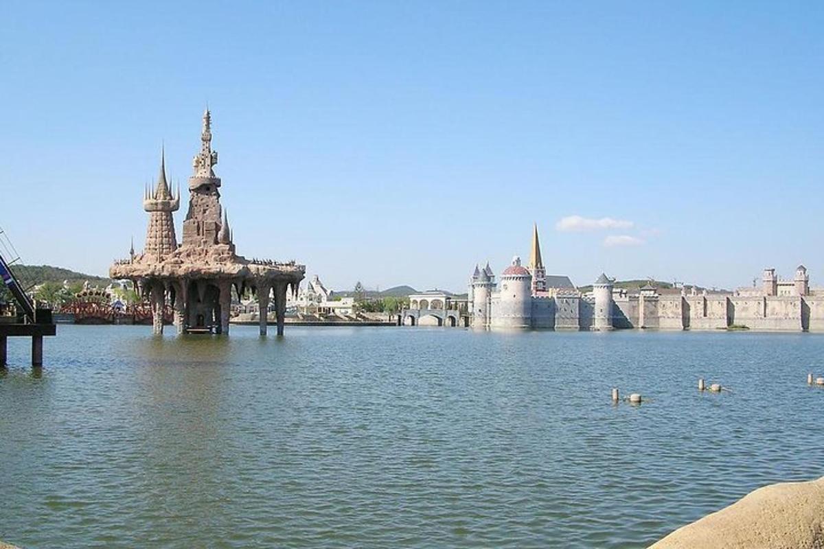 a large body of water with a castle in the background