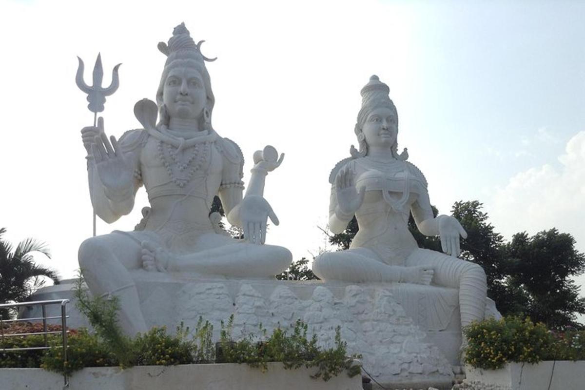 two large white statues sitting next to each other