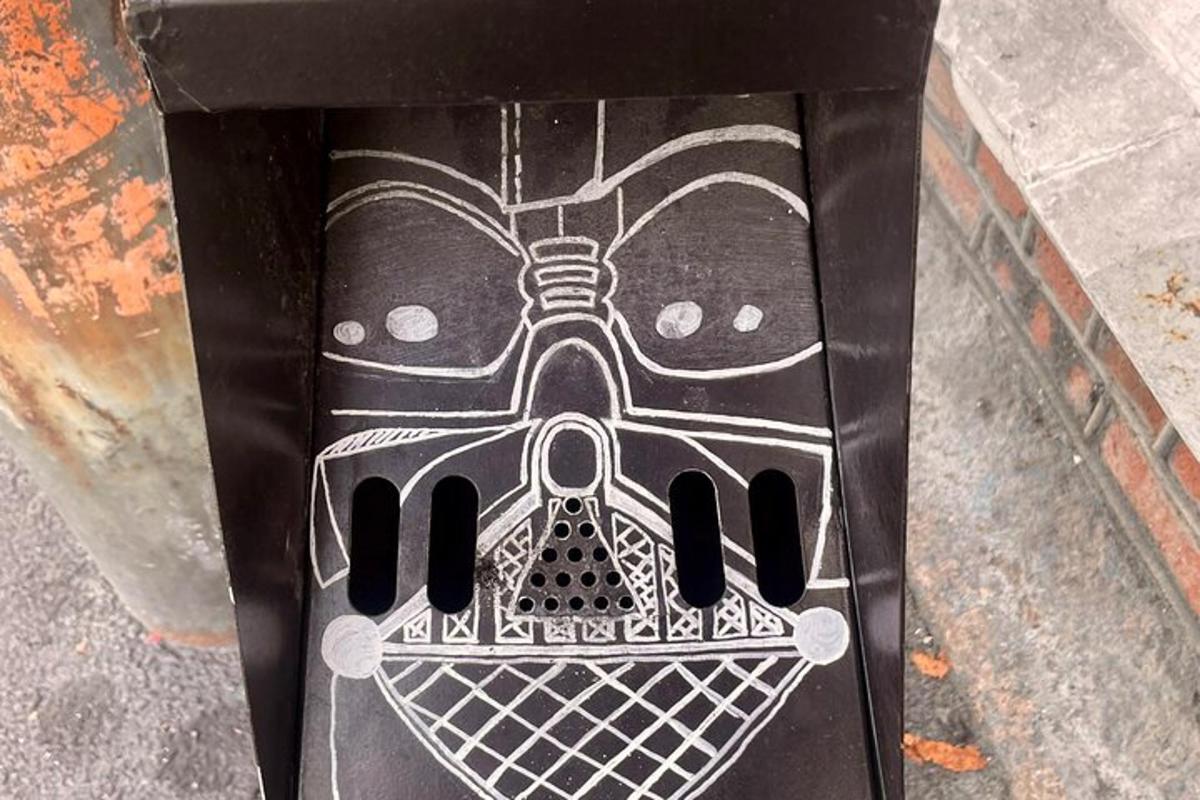 a black box with a picture of a mask