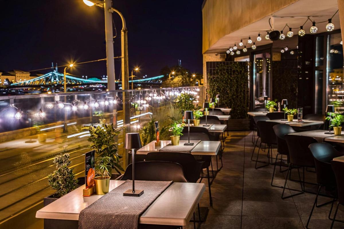 a row of tables on a rooftop at night