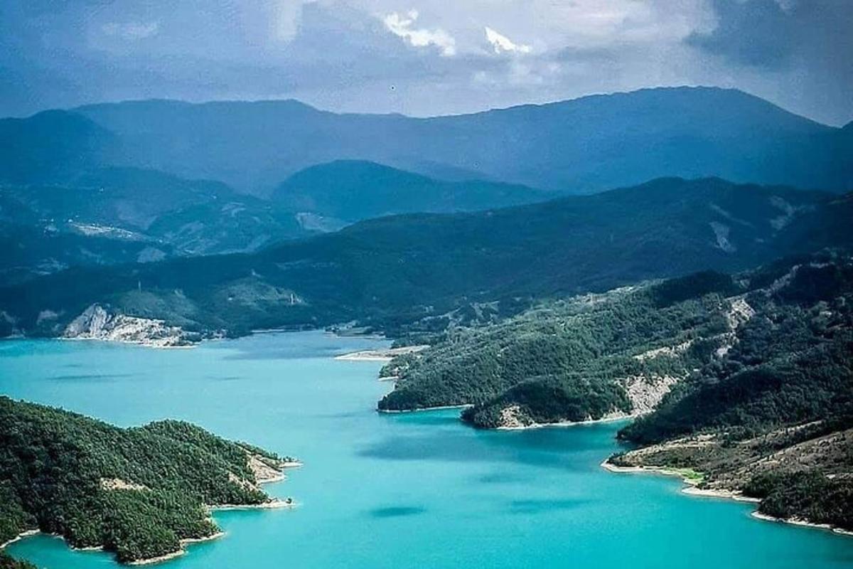 an aerial view of a river in the mountains