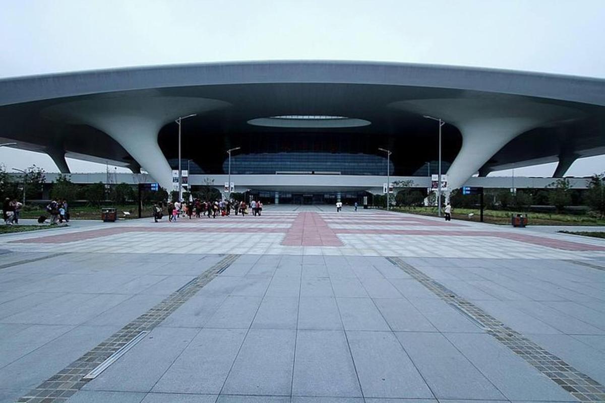 a large building with people walking around it