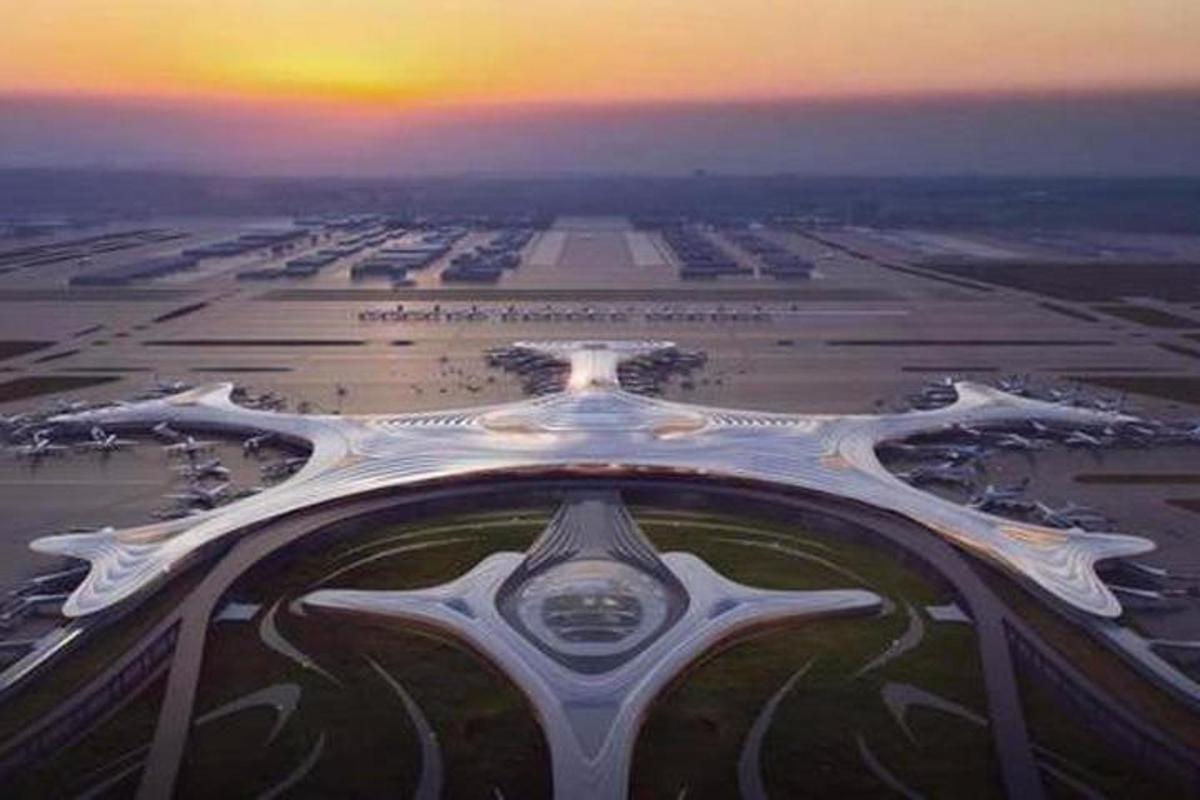 an aerial view of an airport runway at sunset