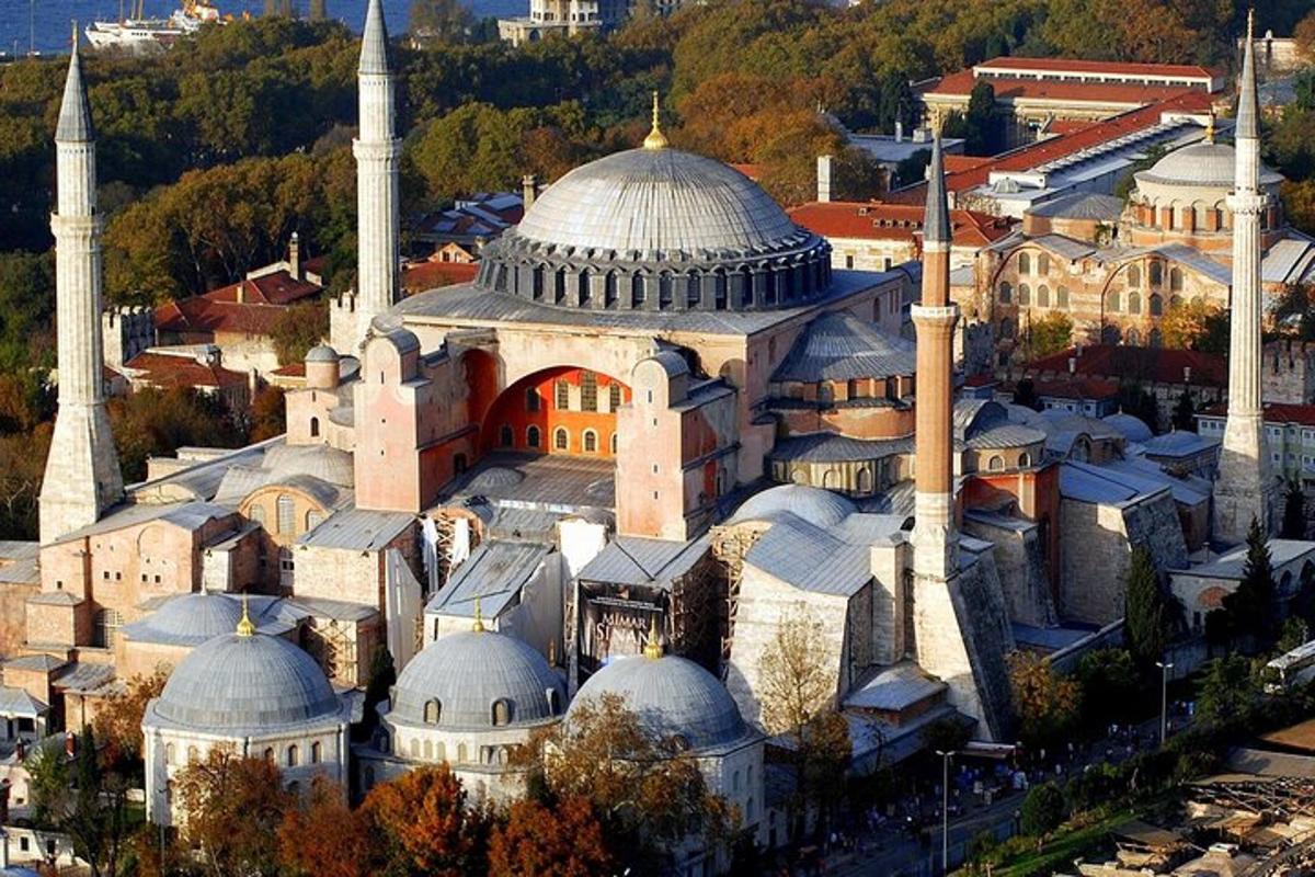 an aerial view of a mosque with domes and buildings