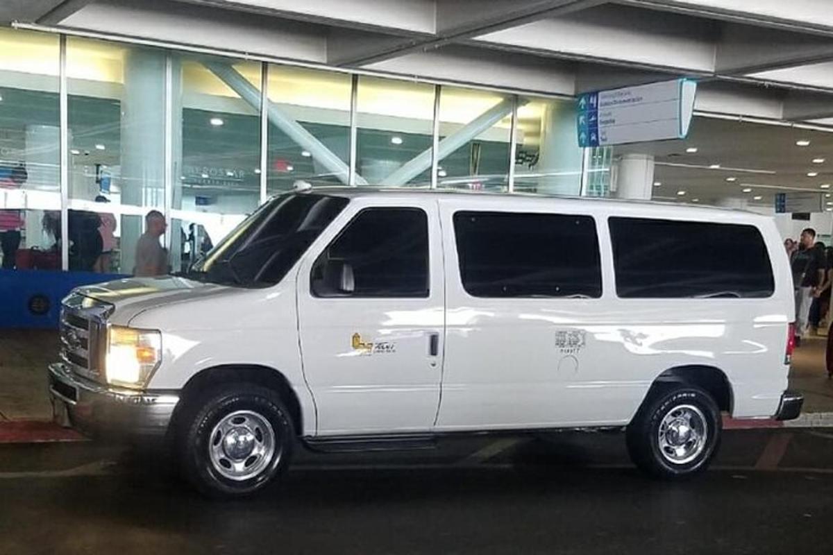 a white van parked in front of a building