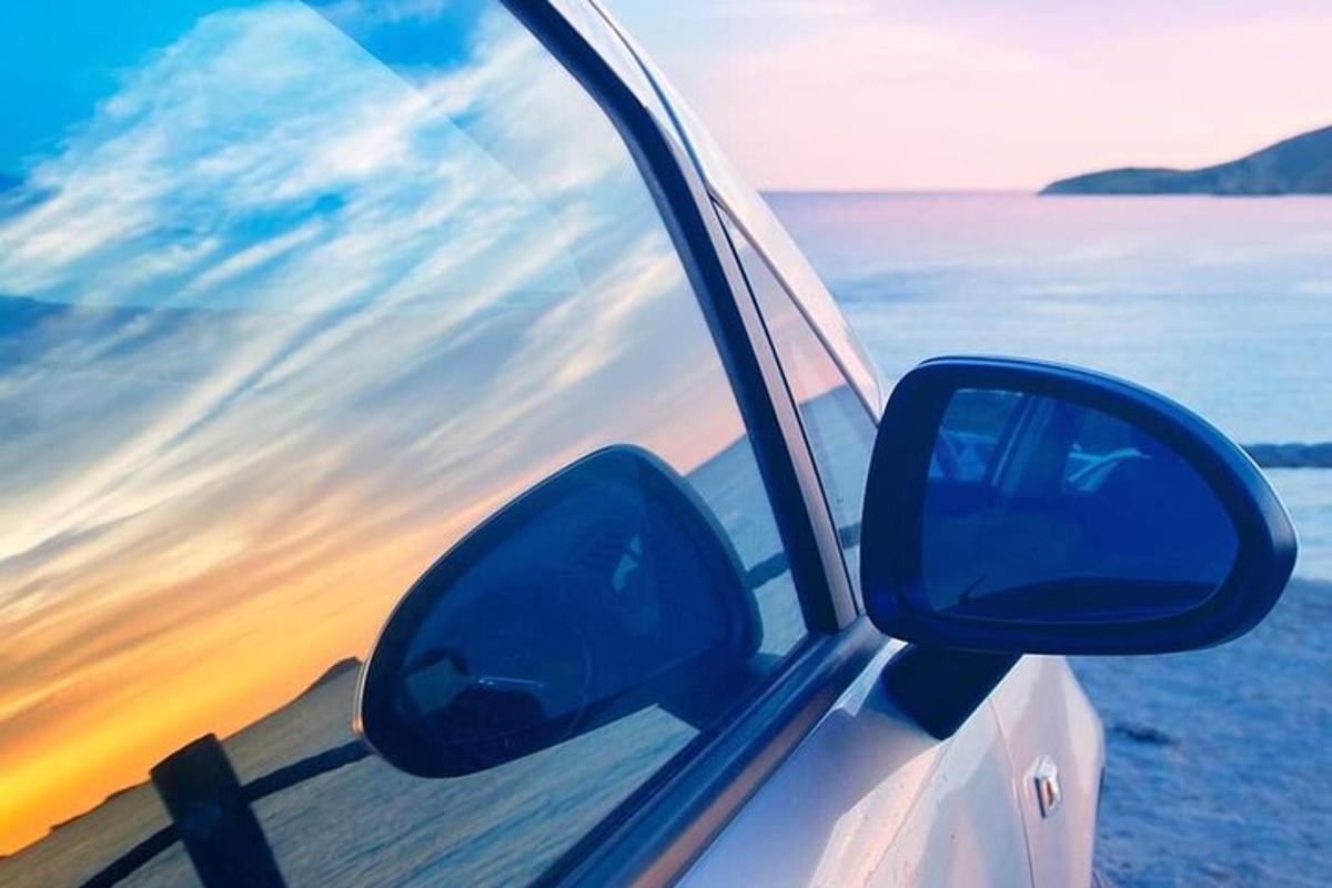 a view of the side view mirror of a car