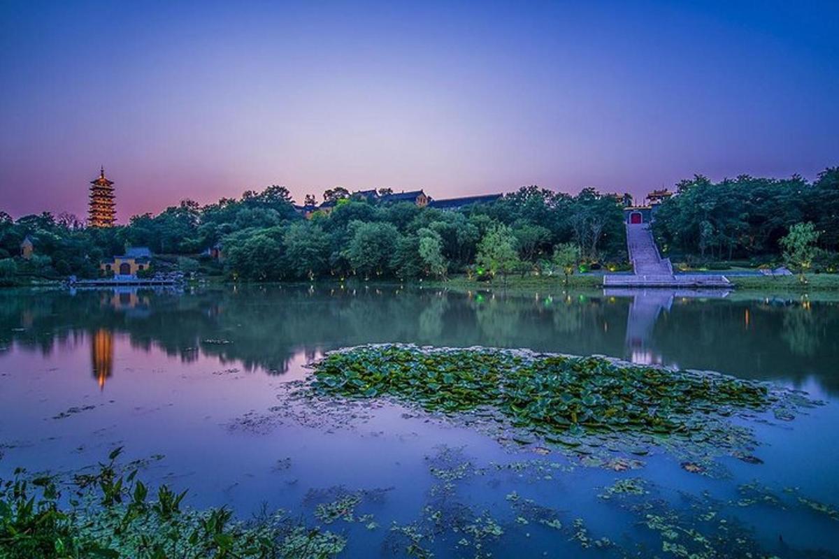 a body of water with a monument in the middle