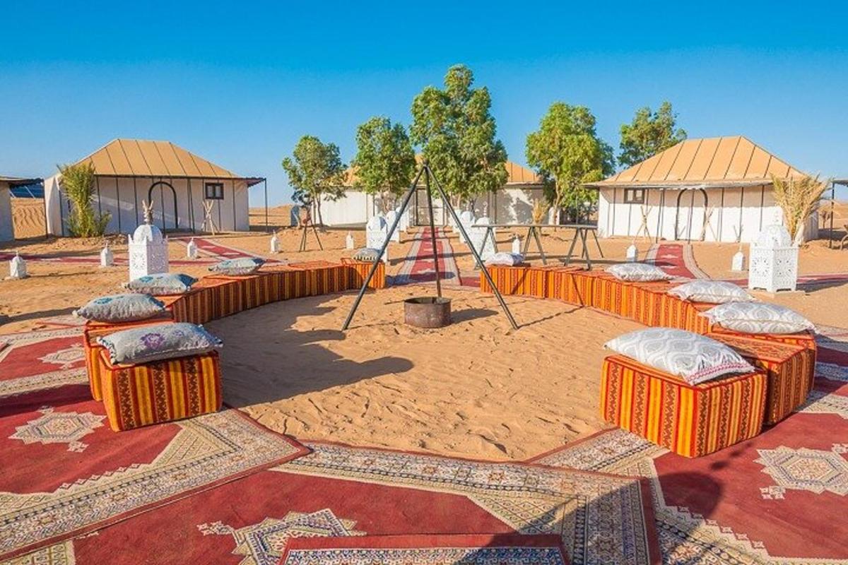 a playground with orange containers and a swing set