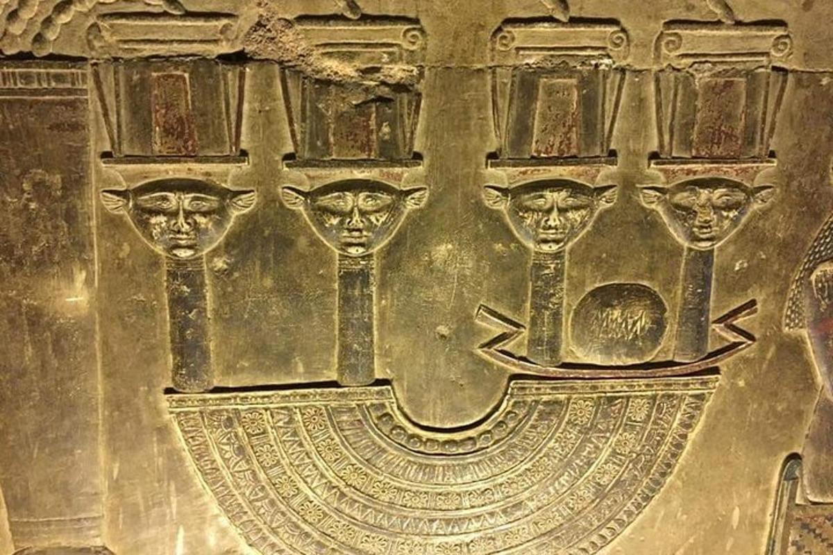 a metal object with two heads on a wall