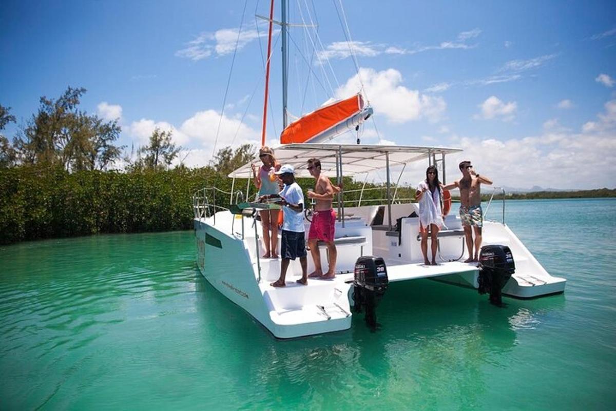 a group of people standing on a boat in the water