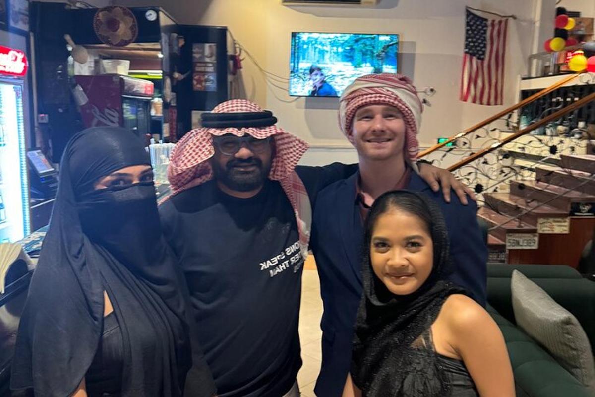 a group of three people posing for a picture