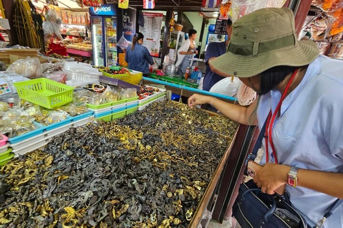 a woman in a hat looking at seafood in a store