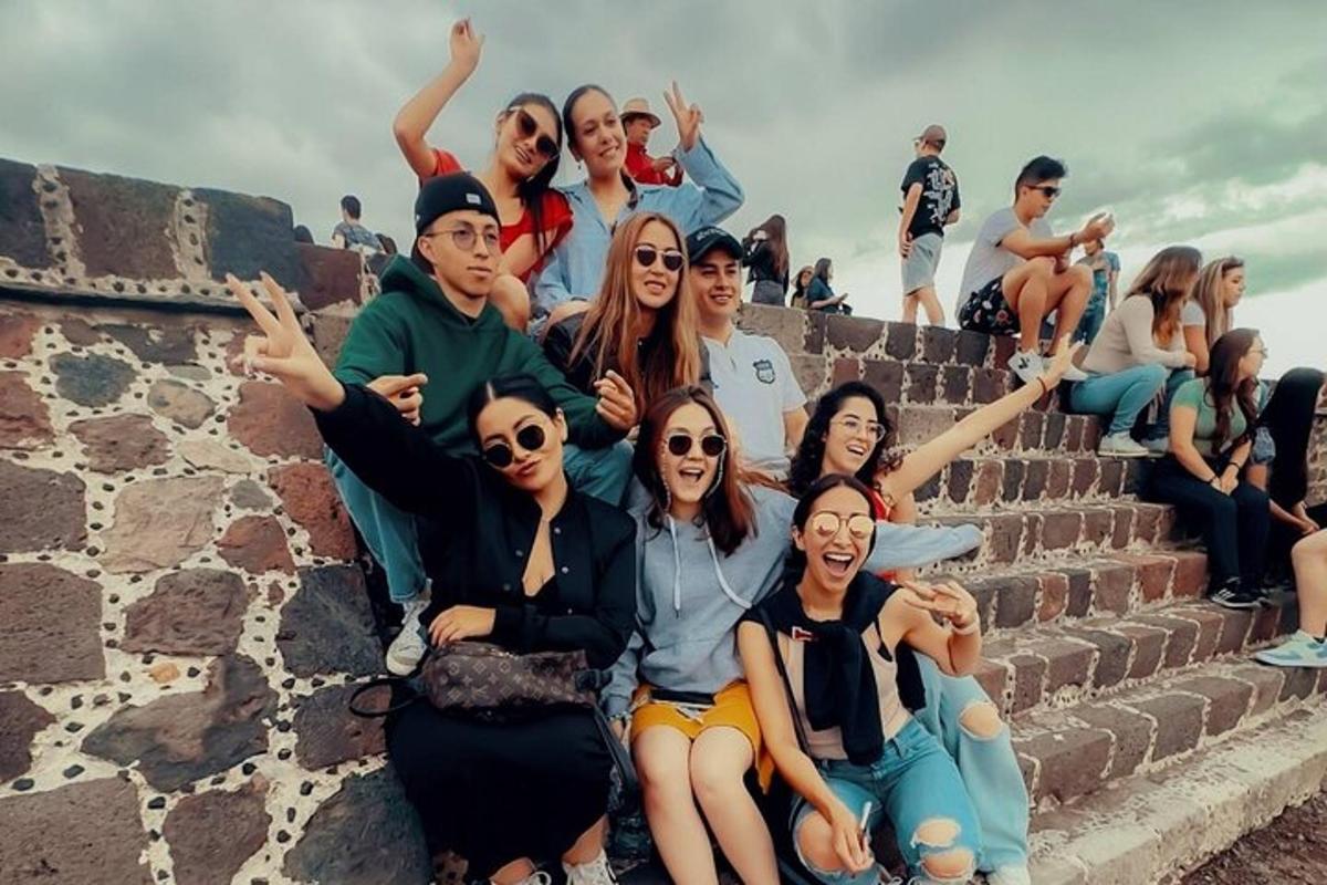 a group of people sitting on some steps