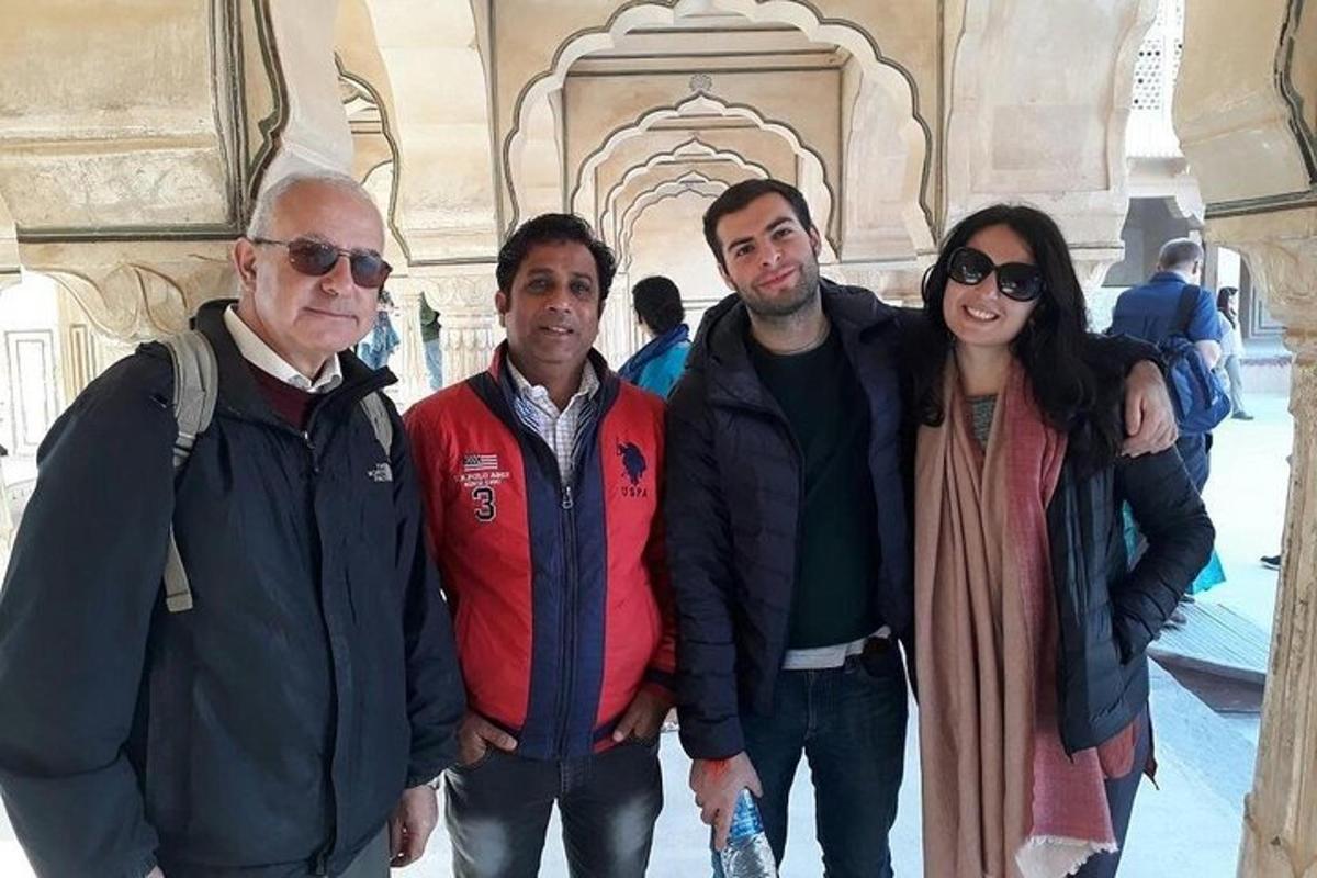 a group of people posing for a picture in a building