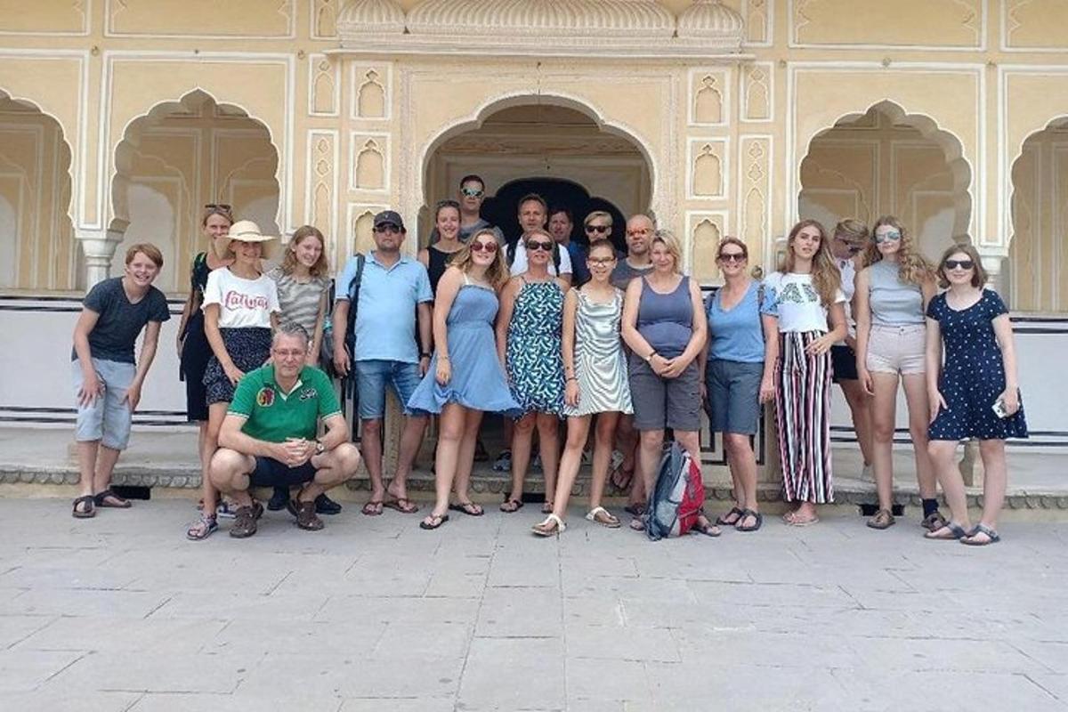 a group of people posing in front of a building