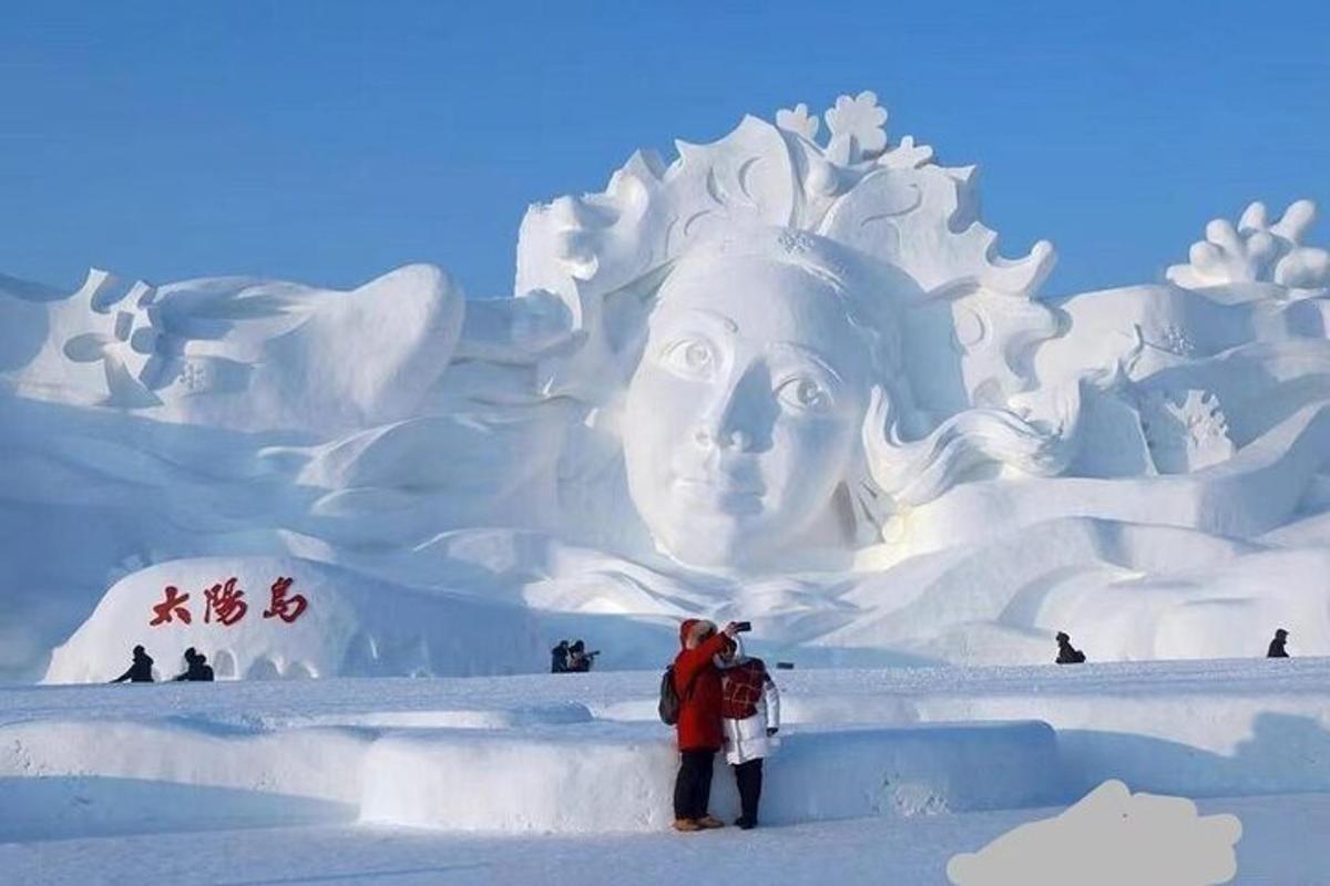a group of people standing in front of an ice sculpture