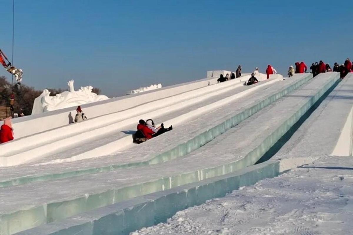 a group of people sitting on the snow covered steps