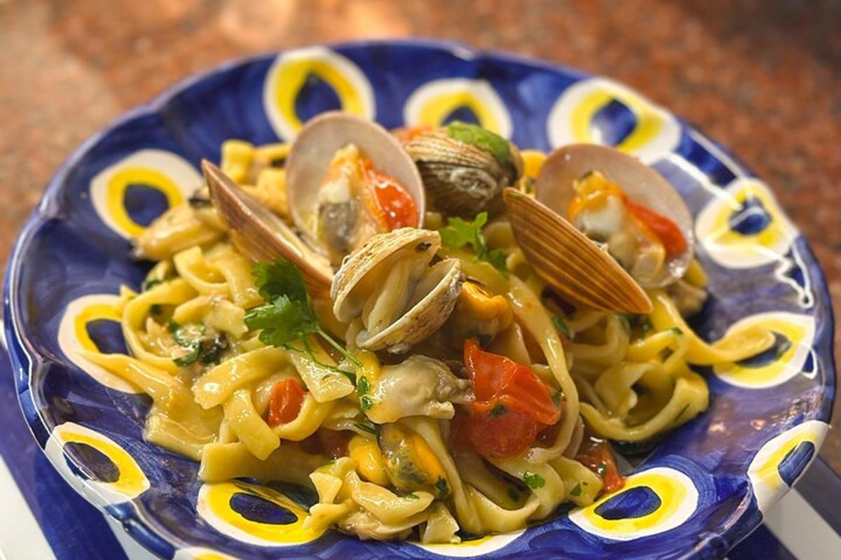 a plate of pasta with mushrooms and vegetables