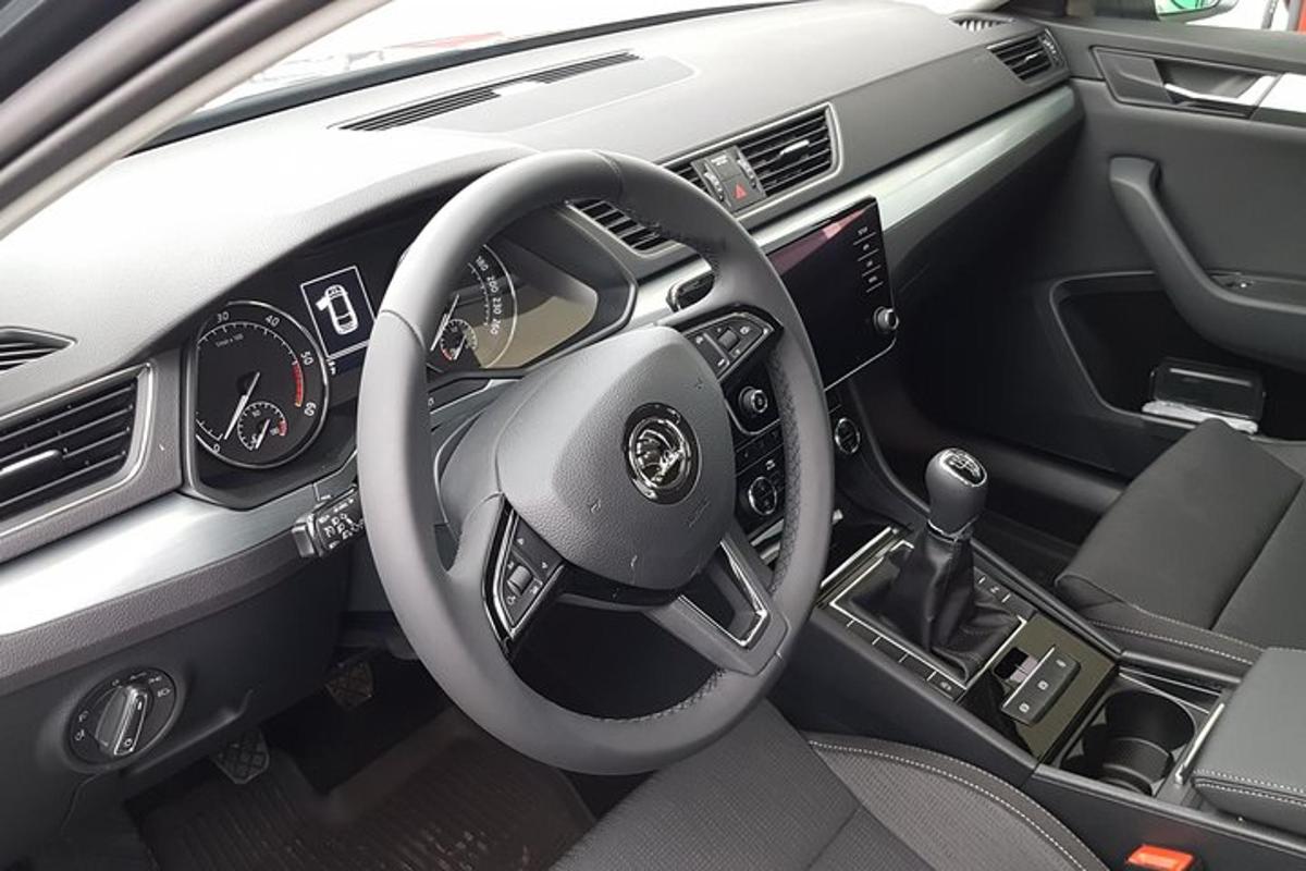 a view of the steering wheel of a car