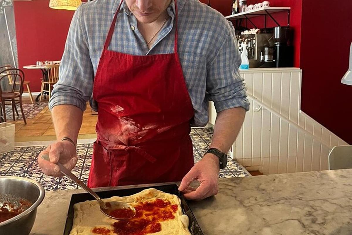 a man in a kitchen preparing food on a counter