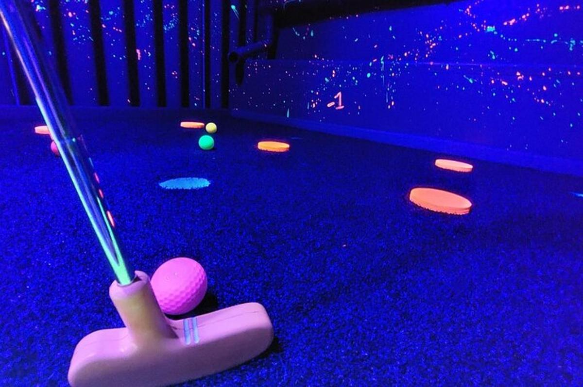 a game of snooker in a purple room with a stick