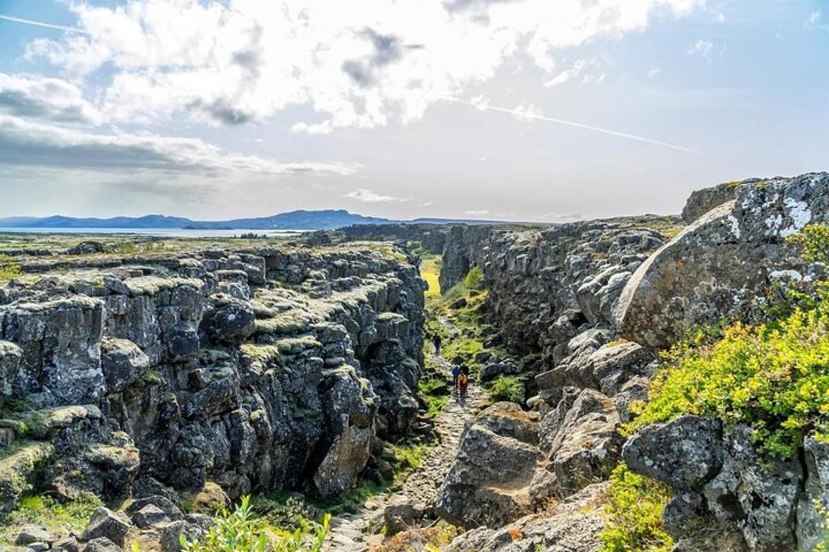 a person standing on a rock wall
