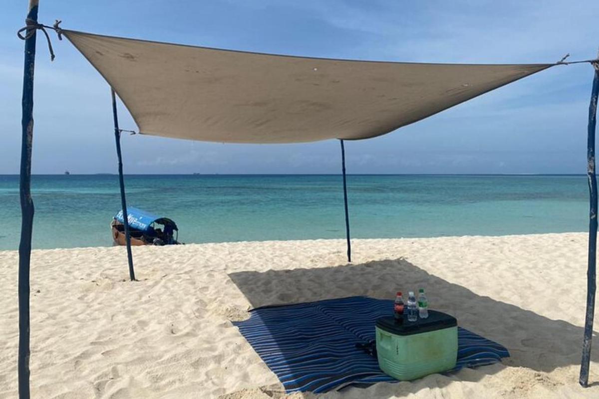 a table on the beach under a tent on the beach