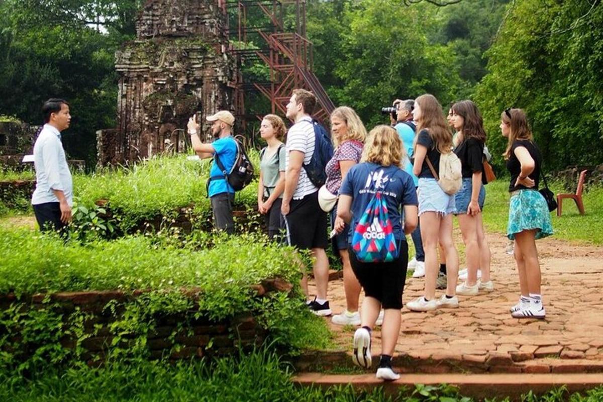 a group of people standing in front of a structure