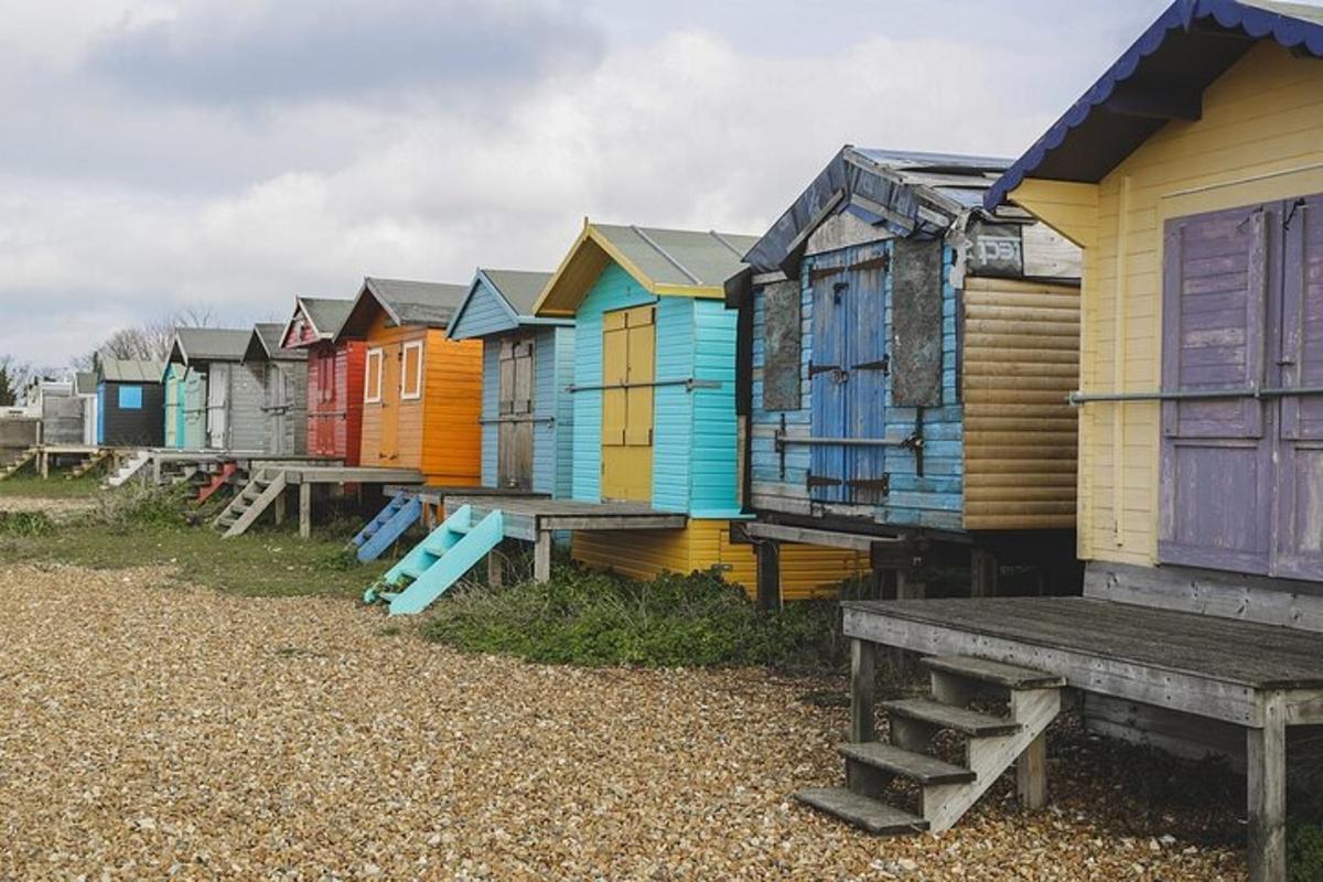 a row of colorful beach huts on the beach
