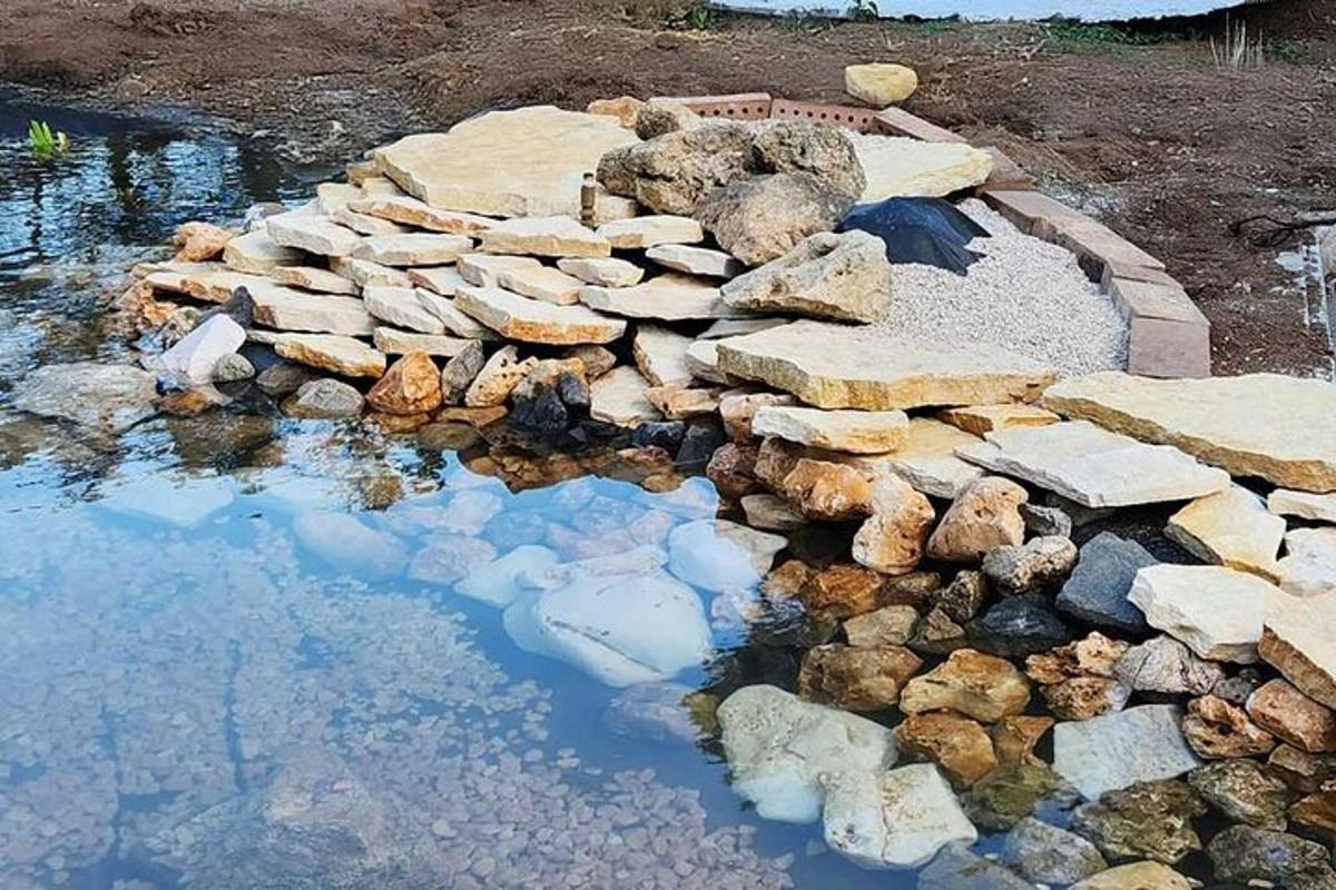 a pile of rocks in a pool of water