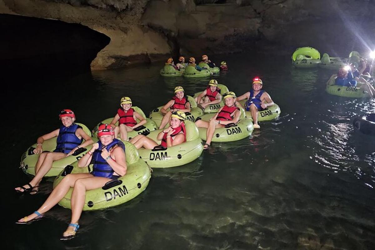 a group of people in kayaks in a cave