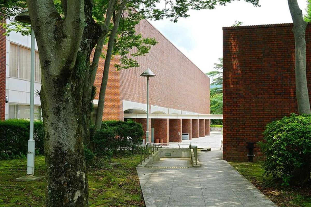 a brick building with a bench in front of it