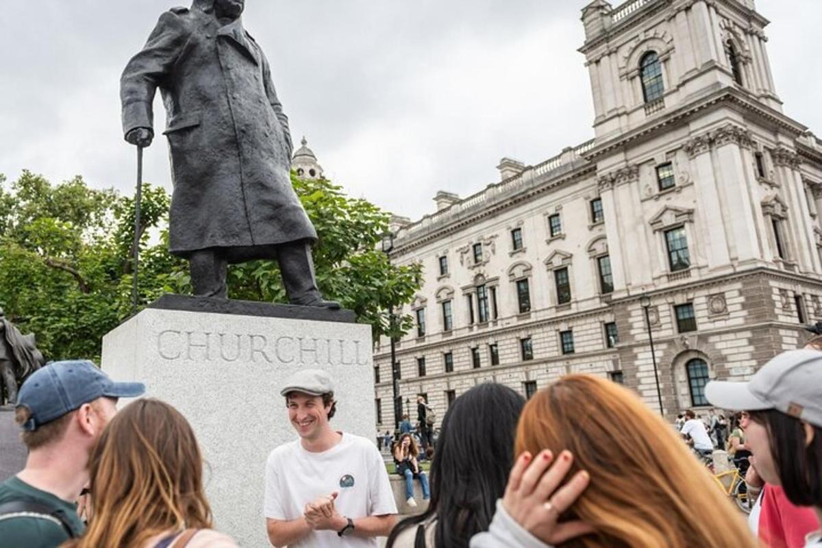 a group of people standing in front of a statue